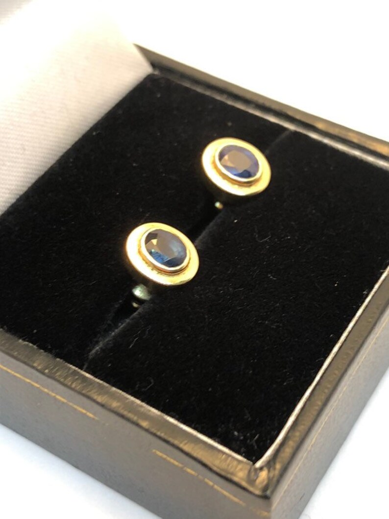 18 carat gold blue sapphire stud earrings 8 millimetres long