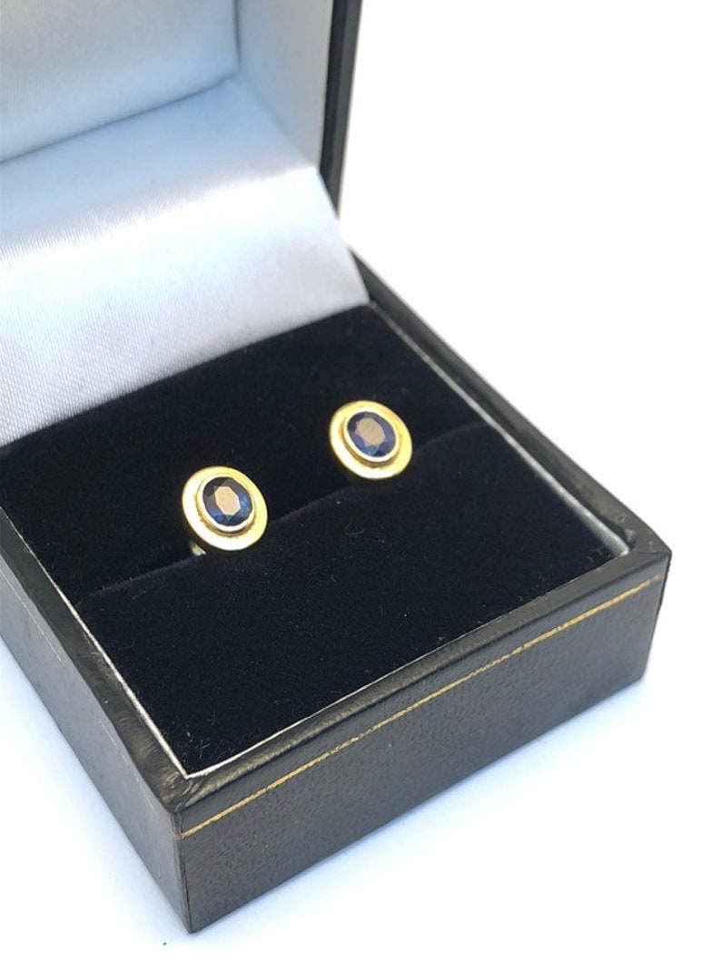 18 carat gold blue sapphire stud earrings 8 millimetres long