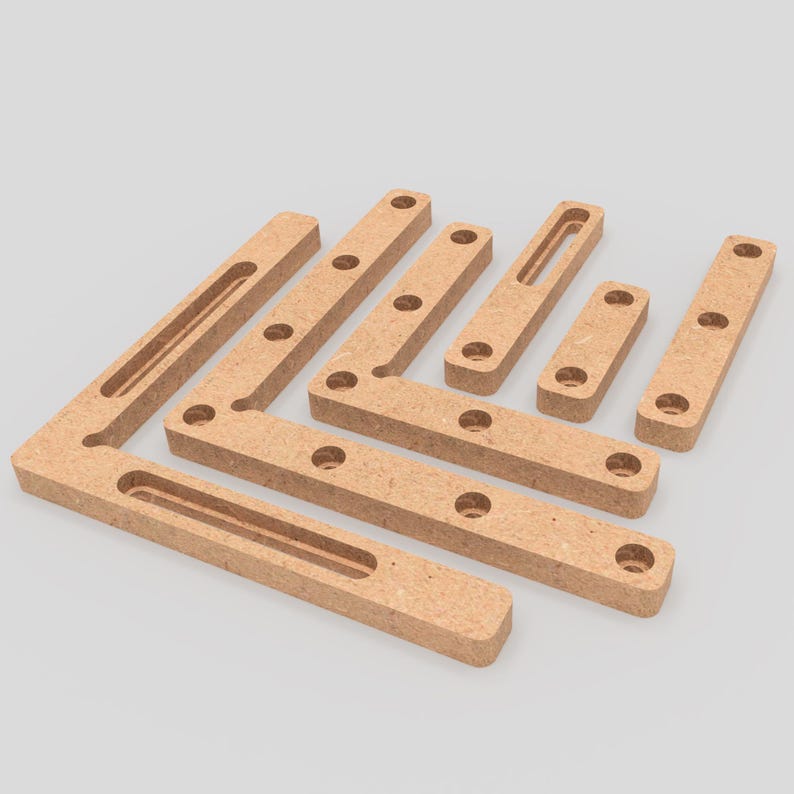 May include: Set of nine wooden corner brackets with multiple holes for joining wood pieces. The brackets are made of a light brown wood and have a smooth finish.