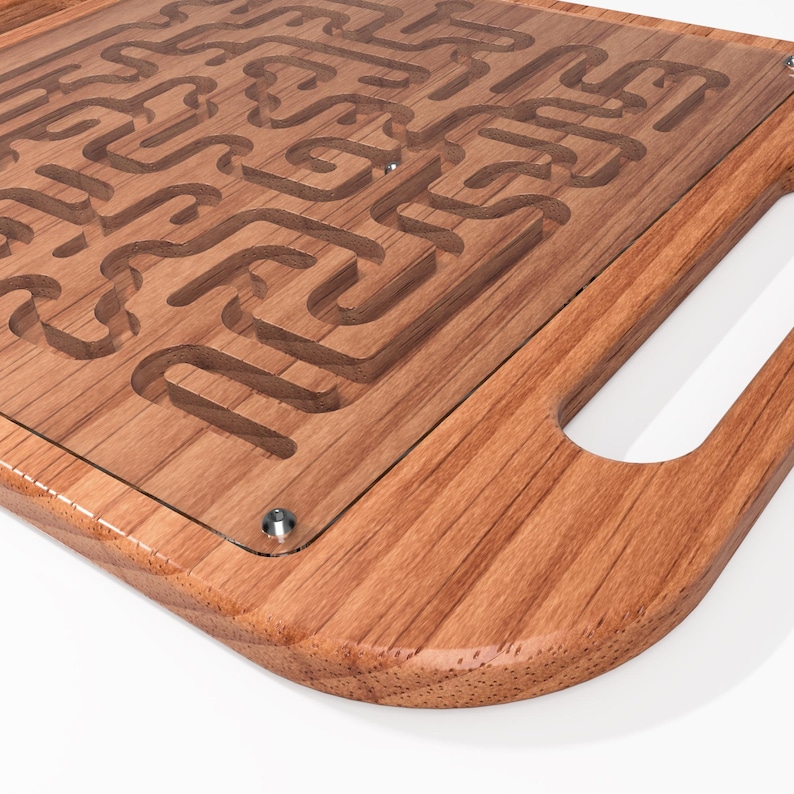 May include: A wooden tray with a glass insert featuring a maze design. The tray has a rounded edge and a handle on the side.