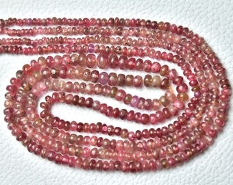 May include: A strand of pink ruby beads, approximately 2mm in size, with a faceted finish. The beads are strung on a clear thread and are ready to be used for jewelry making.