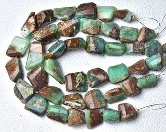 May include: Strand of faceted, irregular-shaped beads. The beads are a mix of green and brown tones, with a polished, crystalline appearance. The beads are strung on a thin, silver-colored wire, ready for jewelry making.