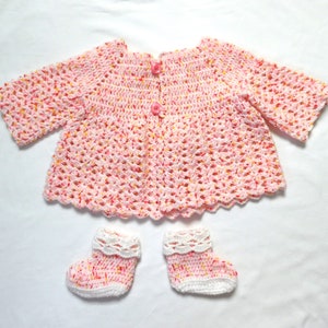 Crochet baby girl cardigan and booties set in pink tones 1 to 3 months