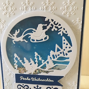 Tarjeta navideña plana con bola de nieve Shacker