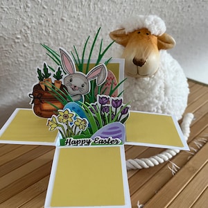 carte de Pâques peinte à la main avec des lapins et des fleurs