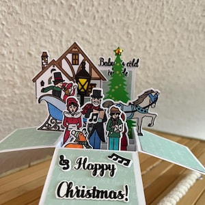 Weihnachtskarte mit Sängern und Schlitten