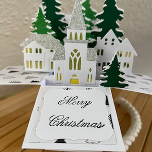 Merry ChristmasWeihnachtskarte Häuser Kirche