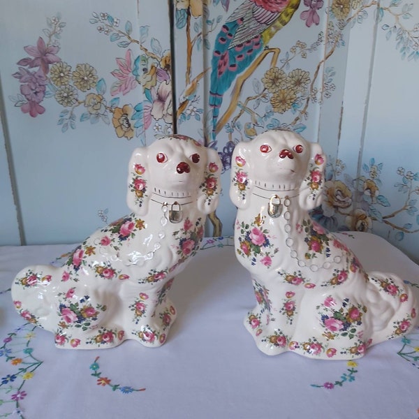 A Pair of Vintage Mantle Dogs with a Floral Design