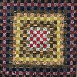 May include: A quilt with a checkered pattern in the center surrounded by a border of brown, green, and yellow squares. The border is surrounded by a larger border of black, red, and white squares.
