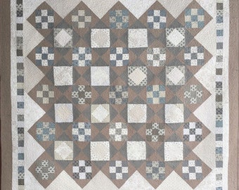 Grace June quilt pattern.  56" x 56".  Soft colors but could be made with modern fabrics.  Traditional piecing