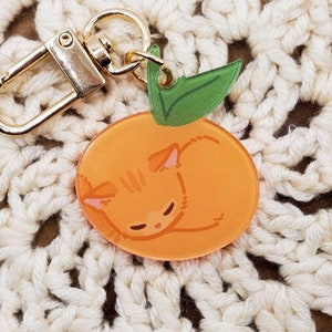 Pomarańczowy brelok z kotem