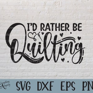 May include: Black and white graphic design with the text "I'd rather be quilting" in a stylised font. The design includes a needle and thread inside a heart shape.