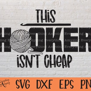 May include: Black and white graphic design with a ball of yarn and a crochet hook. The text reads "This Hooker Isn't Cheap".