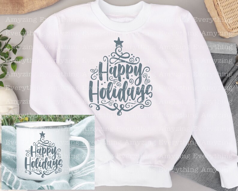 May include: White sweatshirt with a grey design of a stylised Christmas tree with the text "Happy Holidays". A white mug with the same design is shown in the bottom left corner.