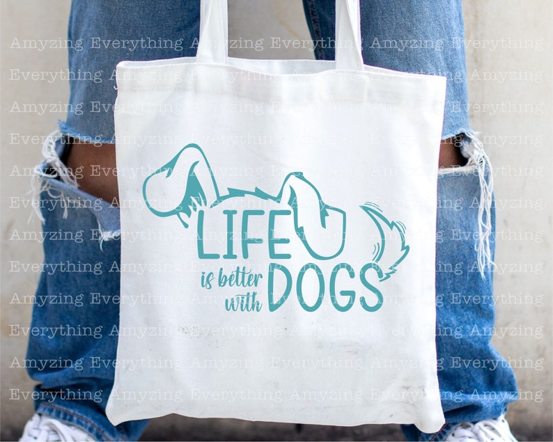 May include: White tote bag with a teal blue graphic that says "Life is better with dogs". The graphic includes a stylized dog with its tail curled up.
