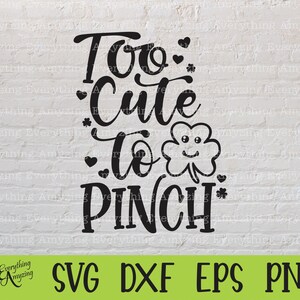 May include: Black and white digital design featuring a shamrock with a smiling face and the text "Too Cute To Pinch".