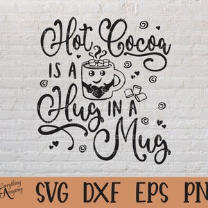 May include: Black and white graphic design with the text "Hot Cocoa is a Hug in a Mug". The graphic features a mug with a smiling face and a heart on its chest. The mug is filled with hot cocoa and marshmallows.