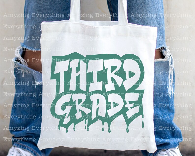 May include: White tote bag with a green and white graphic that says "Third Grade". The graphic has a dripping paint effect.