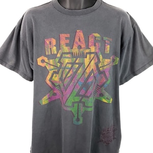 May include: A vintage gray t-shirt with a colorful graphic print of a starburst design with the word "REACT" above it.