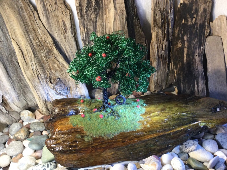a handmade Apple wire tree Childhood Remembered\u201d \u201d A beautiful piece of driftwood and a tire swing to take us back to lazy summer days.