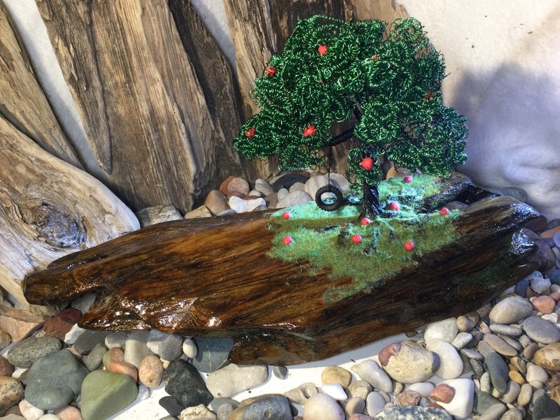 a handmade Apple wire tree Childhood Remembered\u201d \u201d A beautiful piece of driftwood and a tire swing to take us back to lazy summer days.