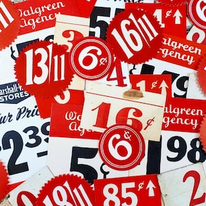 May include: A collection of vintage price tags with red and white circular labels, featuring numbers and the symbol "¢". The tags are printed on white paper with black ink and have a distressed, aged look.