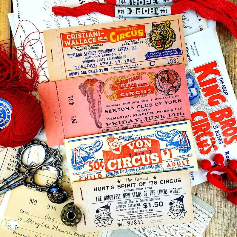 May include: Four vintage circus ticket stubs with red, white, and blue colors. The tickets are for the Cristiani Wallace Bros. Circus, the Sertoma Club of York, Von Bros. Circus, and Hunt's Spirit of '76 Circus. The tickets feature images of elephants, clowns, and tigers.