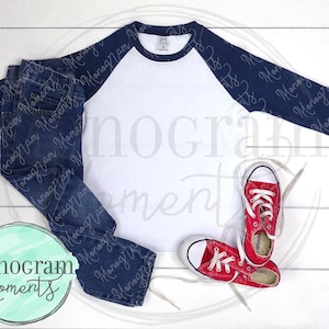 May include: A white and navy blue baseball tee shirt with a red and white pair of sneakers and blue jeans.