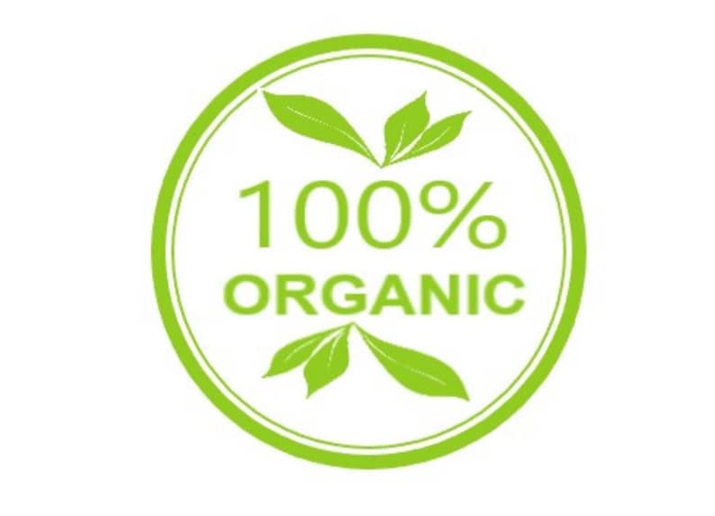 May include: Green circle with a white background and the text "100% ORGANIC" in black. There are two green leaves on either side of the text.