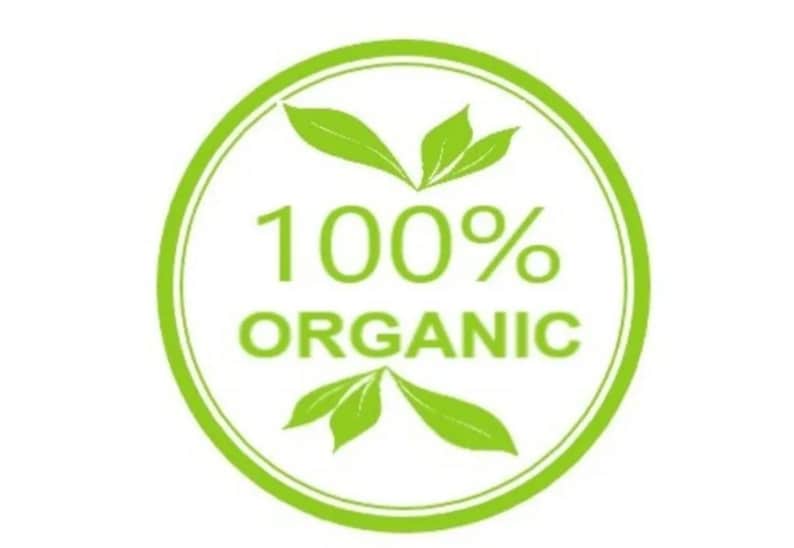 May include: A green circle with white text that reads "100% ORGANIC" and two green leaves on either side of the text.