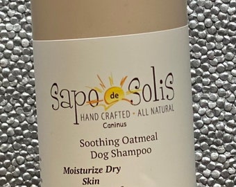 May include: A 16-ounce bottle of Sapo de Solis Caninus Soothing Oatmeal Dog Shampoo. The bottle is white with a brown label and features a picture of a Chow Chow dog. The label reads "Hand Crafted - All Natural" and "Moisturize Dry Skin plus Itch Relief". The bottle also states that the shampoo is pH balanced, paraben and alcohol free.