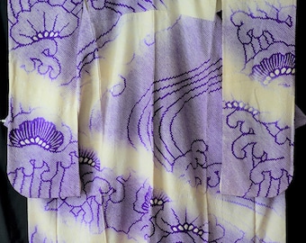 May include: A traditional Japanese kimono with a white background and a purple floral pattern. The kimono is made of silk and has a beautiful, intricate design.