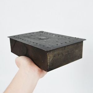 May include: A rustic wooden sign with the text "Welcome to our home" in white lettering. The sign features a distressed finish and a simple, inviting design, perfect for entryway decor.