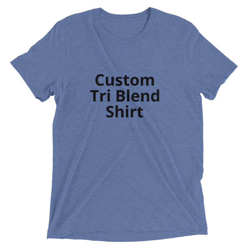 May include: A blue t-shirt with the text "Custom Tri Blend Shirt" printed on the front.