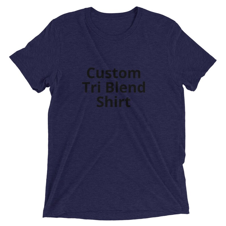 May include: A navy blue t-shirt with the text "Custom Tri Blend Shirt" printed in black.