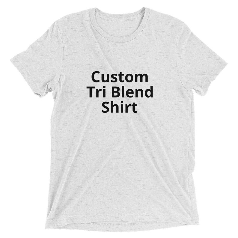 May include: A white t-shirt with the text "Custom Tri Blend Shirt" printed in black.