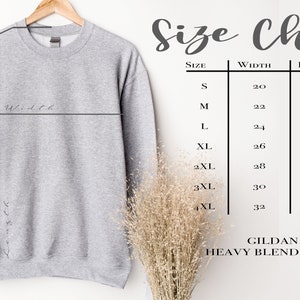 May include: Gray sweatshirt with a size chart showing width, length, and sleeve length measurements in inches for sizes S through 4XL. The chart also includes the text "GILDAN 18000 HEAVY BLEND CREWNECK".
