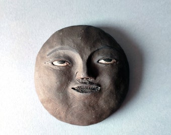 Black clay moon with a cute face, new moon wall decor, handcrafted ceramics, lunar wall pendant, witchy gift, OOAK, original art