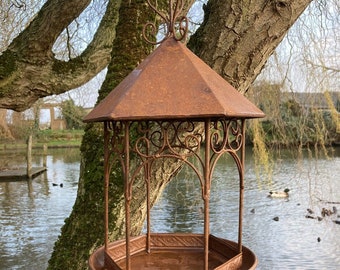 Garden hanging rusty metal bird feeder