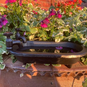 Small cast iron bath tub style birdbath / feeder