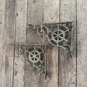 May include: A rustic wooden sign with the text "Welcome to our home" in white lettering. The sign features a distressed finish and a simple, inviting design, perfect for a front porch or entryway.