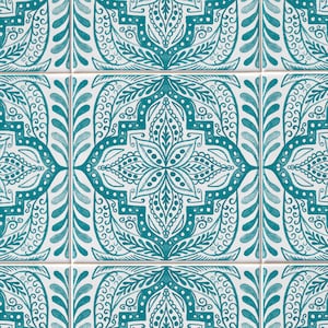 May include: A pattern of nine square tiles with a teal and white floral design. Each tile features a central floral motif surrounded by intricate scrollwork and leaf patterns. The tiles are arranged in a grid, creating a repeating decorative surface.