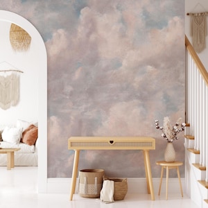 May include: A set of three ceramic mugs with a speckled, matte finish. Each mug features a different color: light blue, cream, and gray. The mugs have a simple, modern design, perfect for coffee or tea.