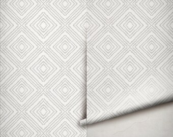 May include: A roll of wallpaper featuring a repeating geometric pattern of diamonds. The design consists of light gray dashed lines on a white background, creating a structured grid of nested diamond shapes across the entire surface of the paper.