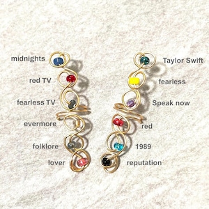 Manchette d'oreille TS. Bijoux ornés de bijoux. Grimpeur d'oreille multicolore
