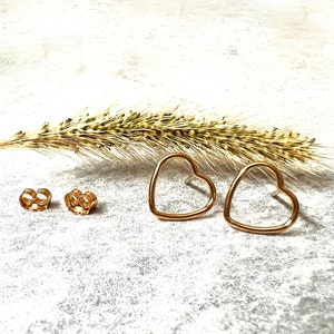 Open Heart gold stud earrings.