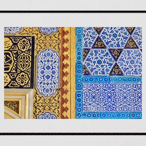 May include: Close-up of intricate blue and white tilework with geometric patterns, contrasting with gold and black tilework in the background.