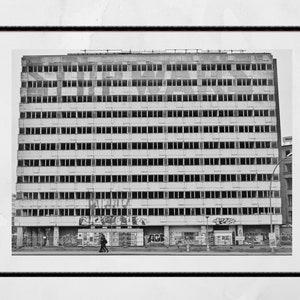 May include: A set of three ceramic nesting bowls in shades of blue, green, and white. The bowls feature a speckled glaze and a simple, modern design. The largest bowl is approximately 7 inches in diameter.