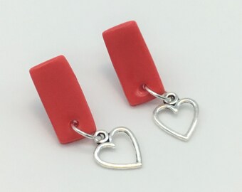 bright red studs with little heart charms