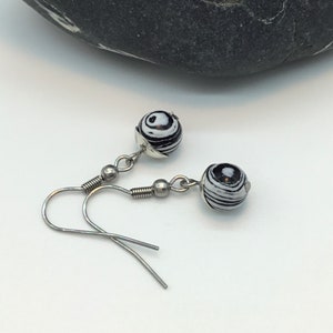 black earrings with a zebra pattern